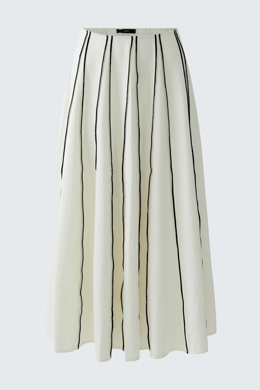 A-line skirt: White with black vertical stripes, flowing design, perfect for casual wear.