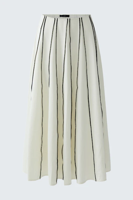 A-line skirt: White with black vertical stripes, flowing design, perfect for casual wear.