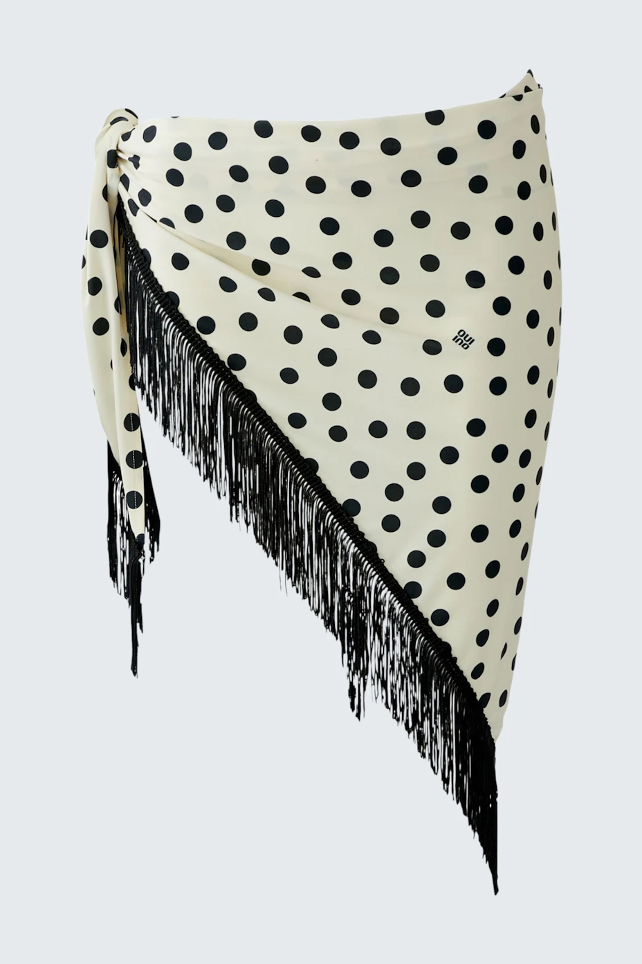 Polka dot scarf with fringe detail, perfect for adding a playful touch to any outfit.