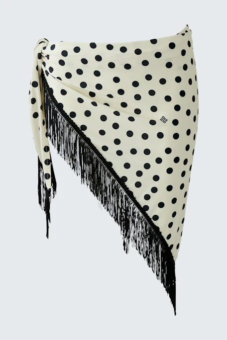 Polka dot scarf with fringe detail, perfect for adding a playful touch to any outfit.