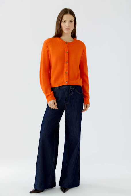 Bright orange cardigan with buttons, perfect for layering. No model, just the garment displayed.