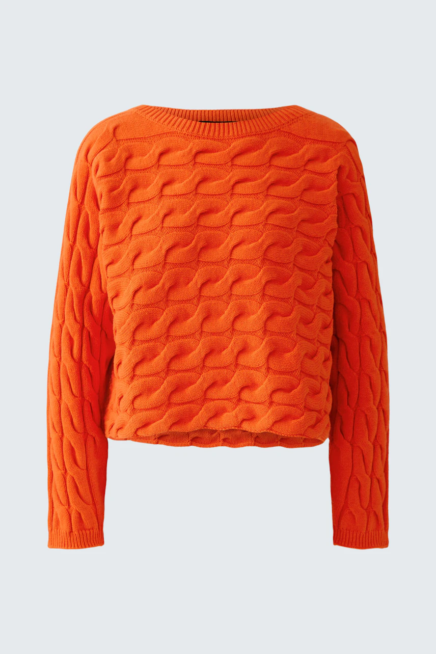 Bright orange pullover with textured wave pattern, perfect for a bold, casual look.