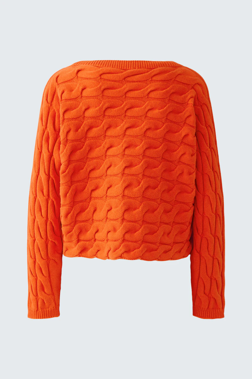 Bright orange pullover with textured pattern, perfect for a bold and cozy look.