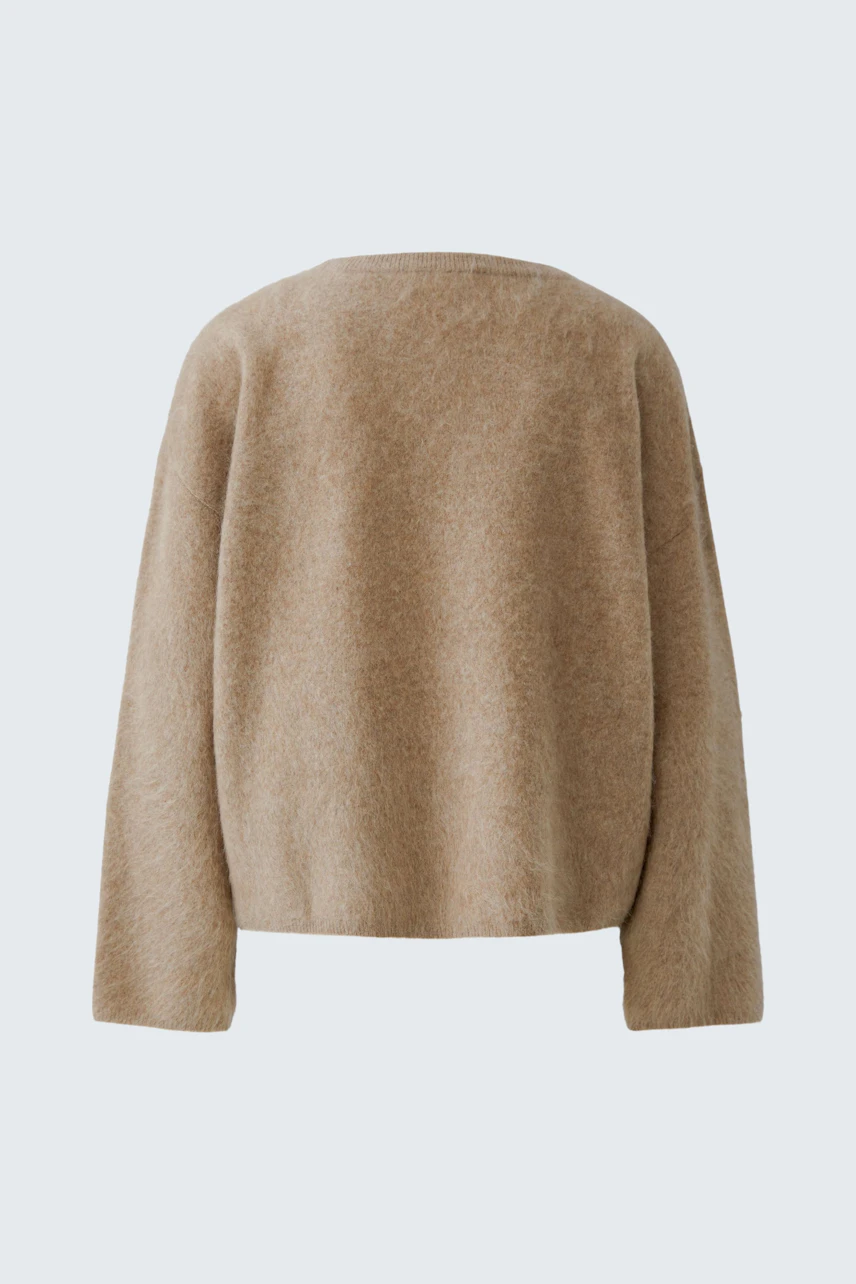 Casual women's pullover in beige, shown from the back, highlighting its soft texture and relaxed fit.