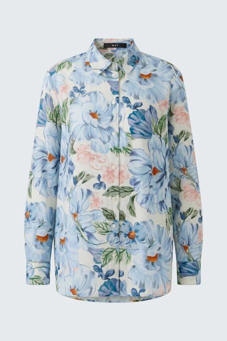 Floral print blouse: Vibrant blue and pink flowers on a white background, perfect for a fresh, casual look.