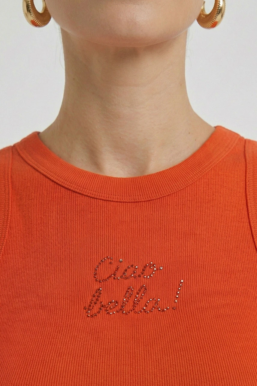 Orange tank top with 'Ciao bella!' text, worn by a woman with gold hoop earrings.
