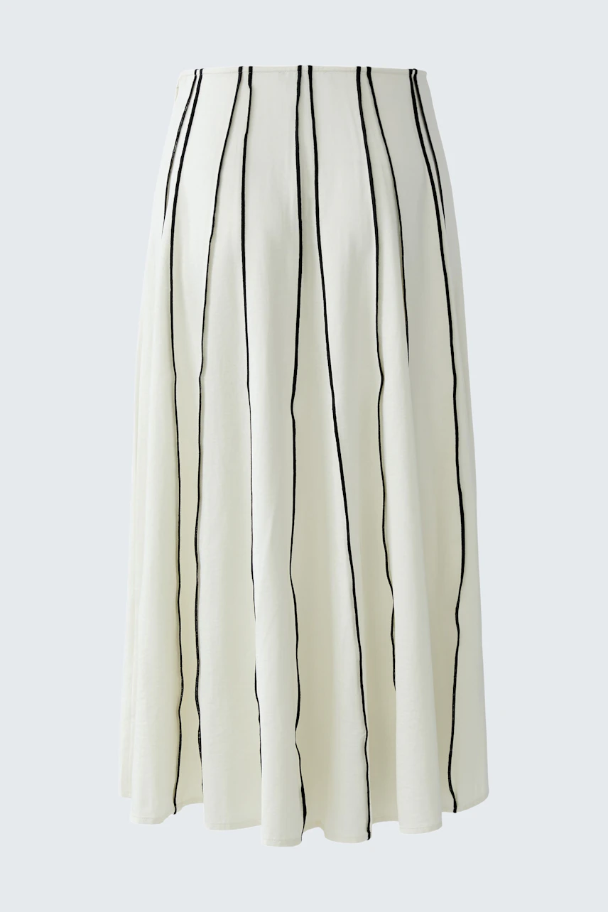 A-line skirt: White with black vertical stripes, flowing design, perfect for casual wear.