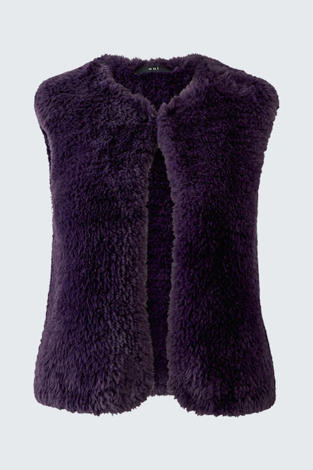 Cozy knit vest in deep purple, perfect for layering. Soft texture adds warmth and style to any outfit.