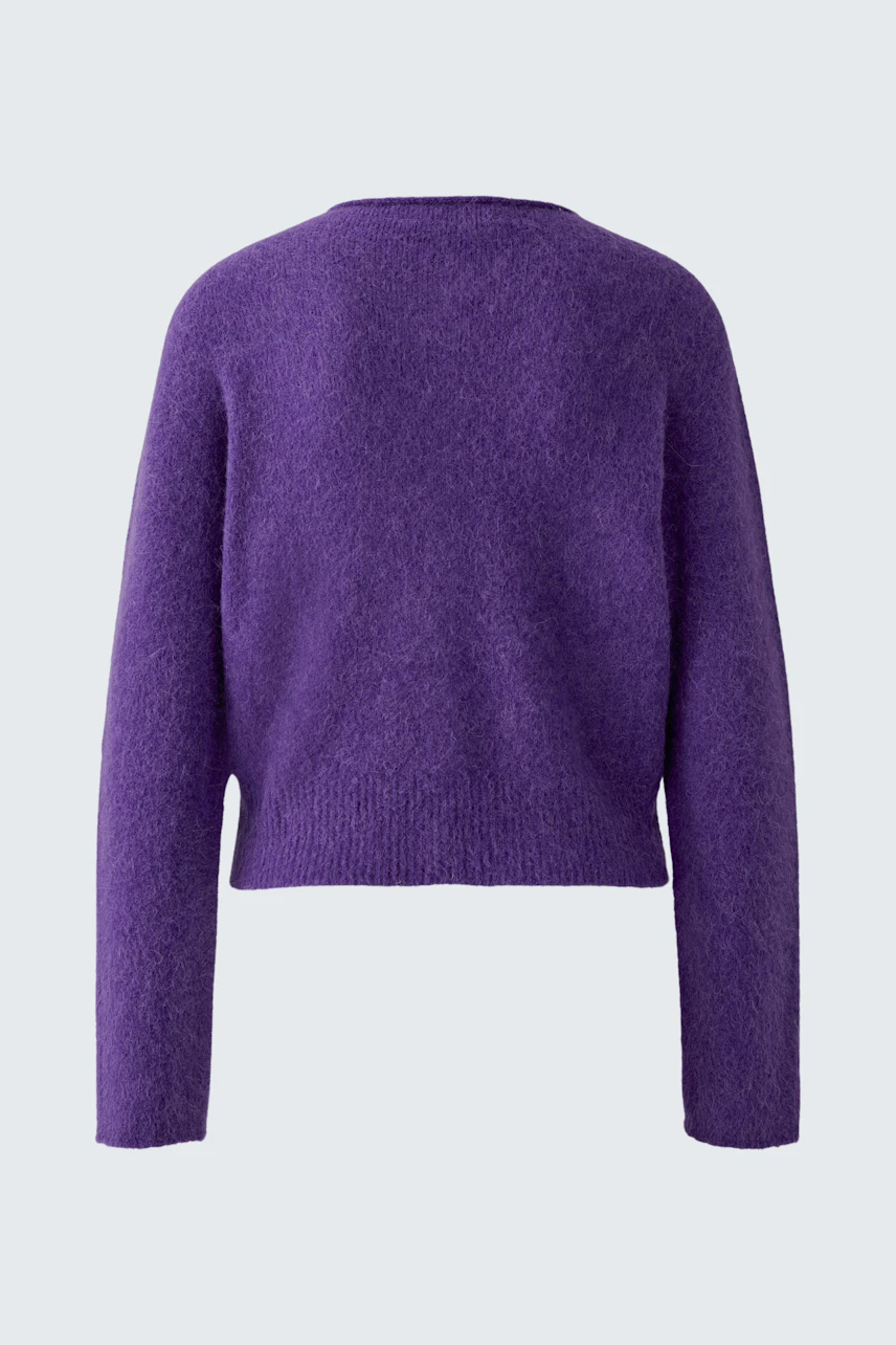 Purple knit cardigan: Cozy and soft texture, perfect for layering in cooler weather.