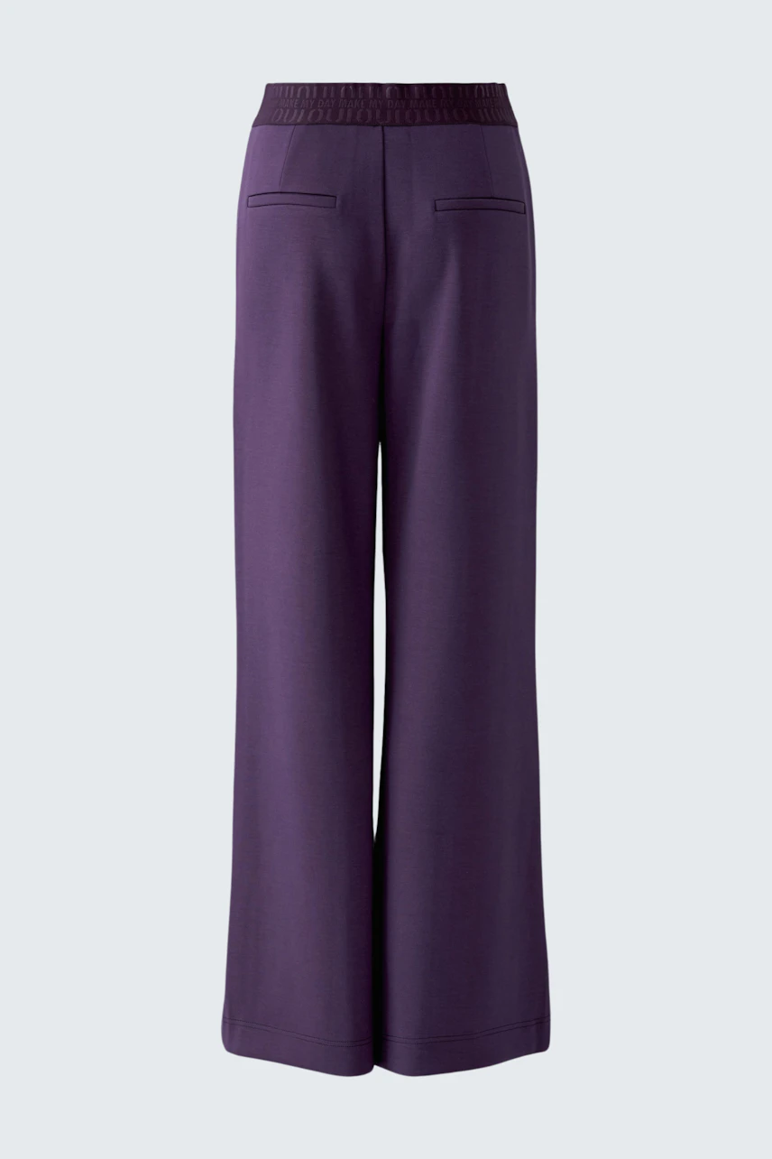 Wide-leg pants in deep purple, featuring a high waist and sleek design. No model is present.
