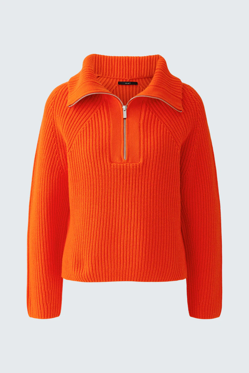 Bright orange pullover with a zip collar, perfect for a bold and cozy look.