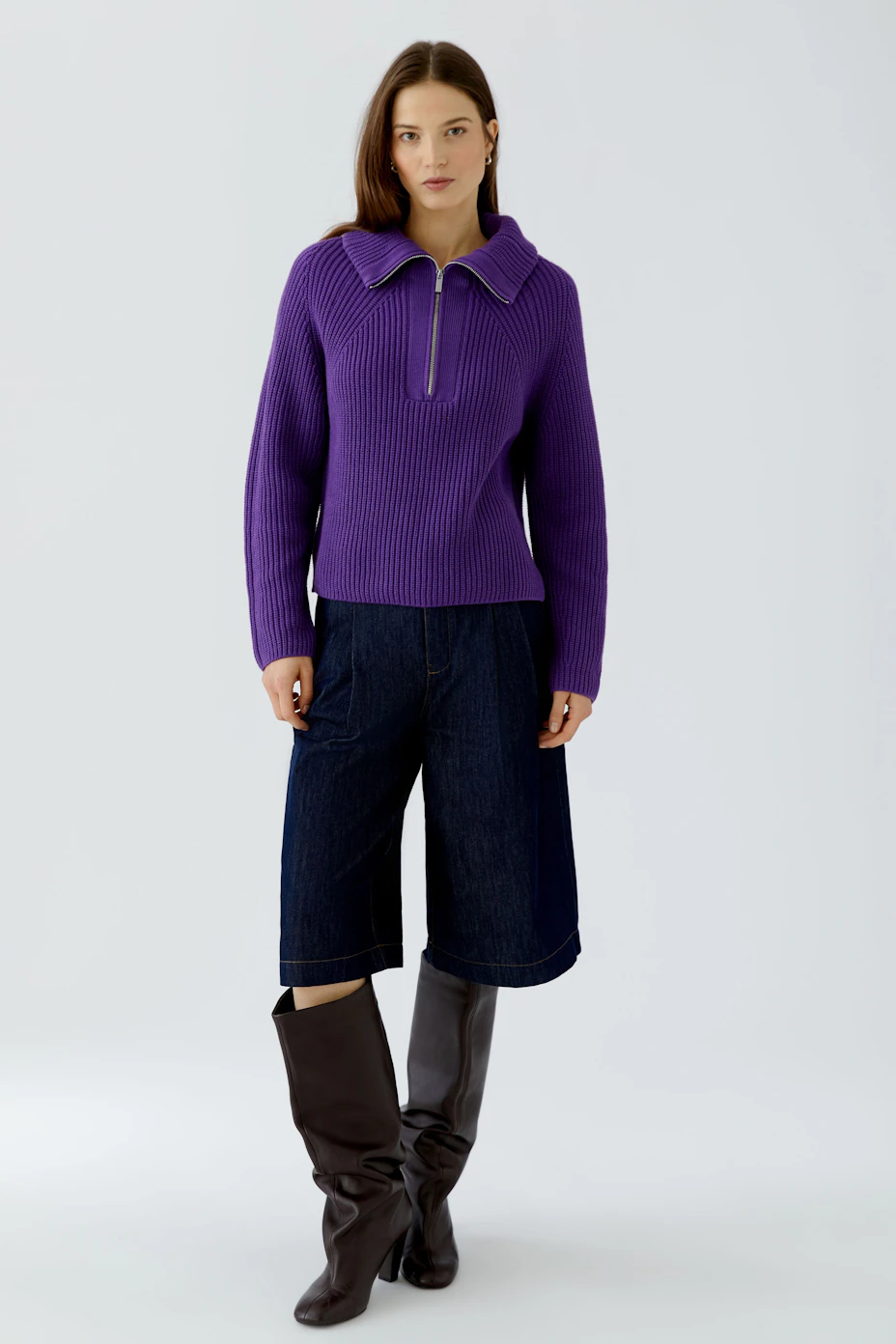 Purple ribbed pullover with a zip collar, displayed on a plain background.