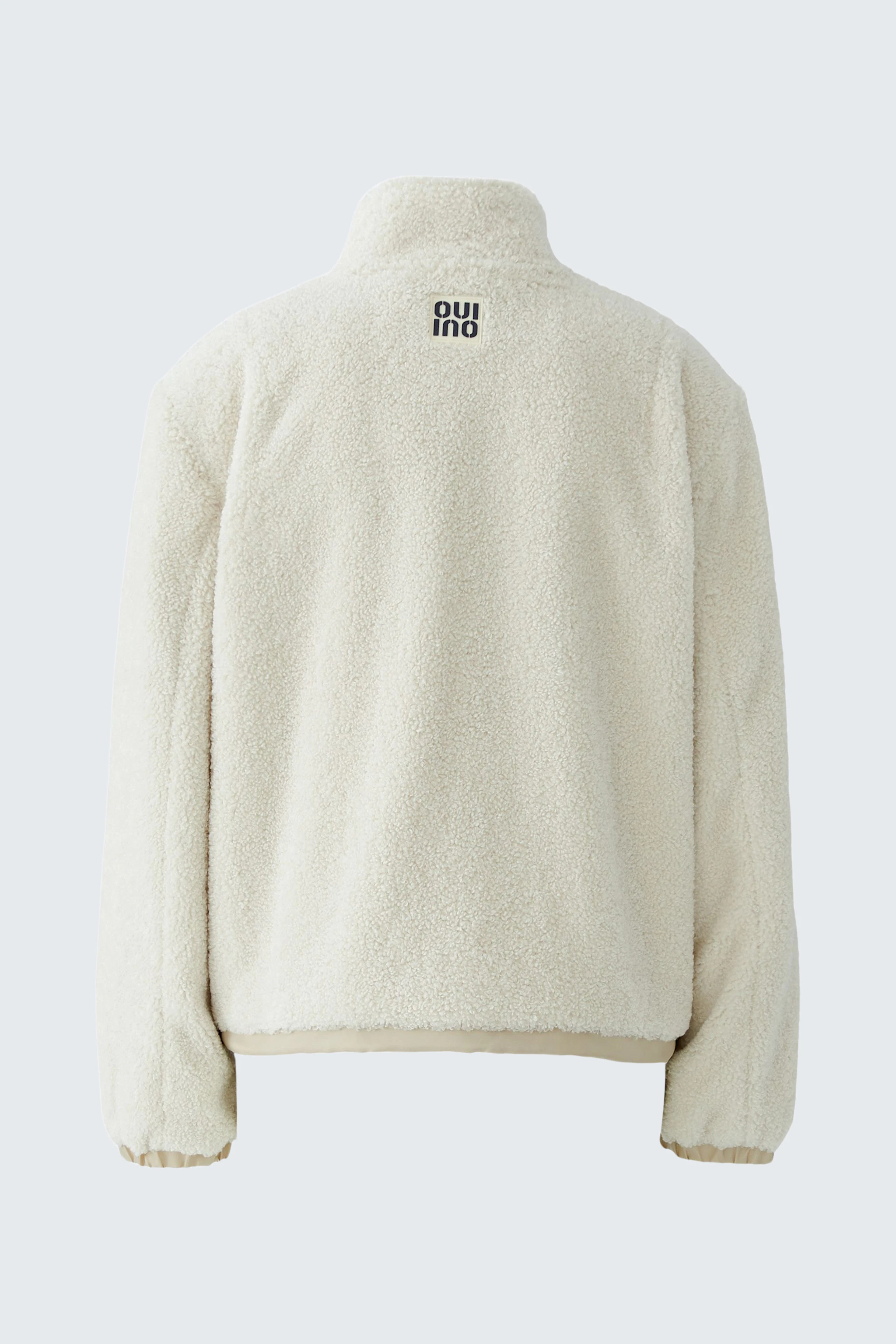 Cozy women's blouson: Cream-colored fleece blouson with high collar, perfect for casual wear.
