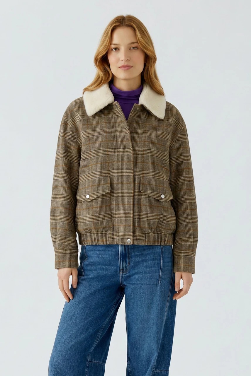 Casual blouson: Woman in a plaid blouson with a shearling collar, purple top, and blue jeans.