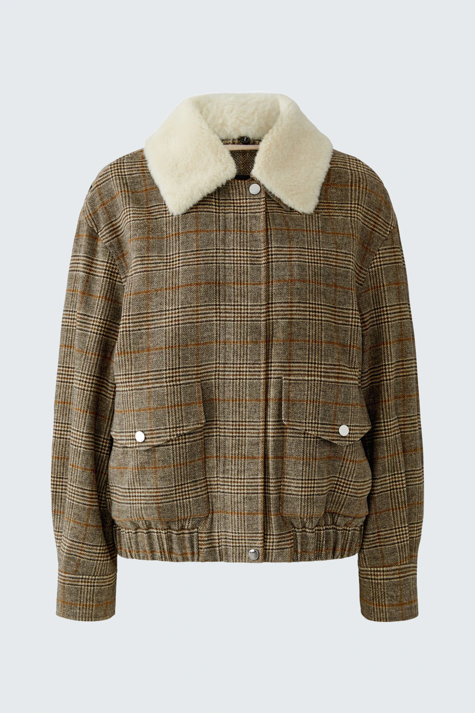 Casual women's blouson: Brown checkered blouson with white faux fur collar, front pockets, and zip closure.