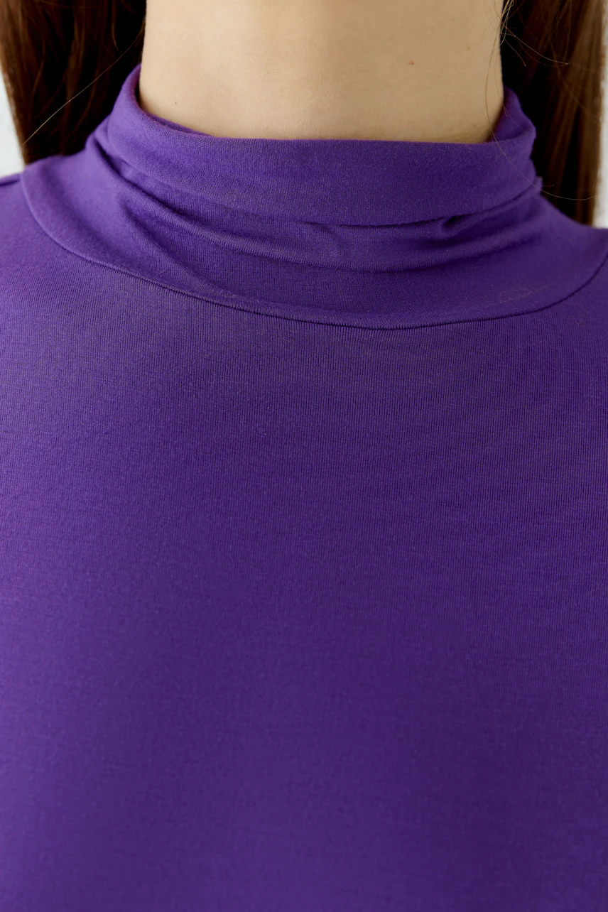 Purple long-sleeve shirt: Close-up of fabric texture, highlighting the smooth and vibrant material.