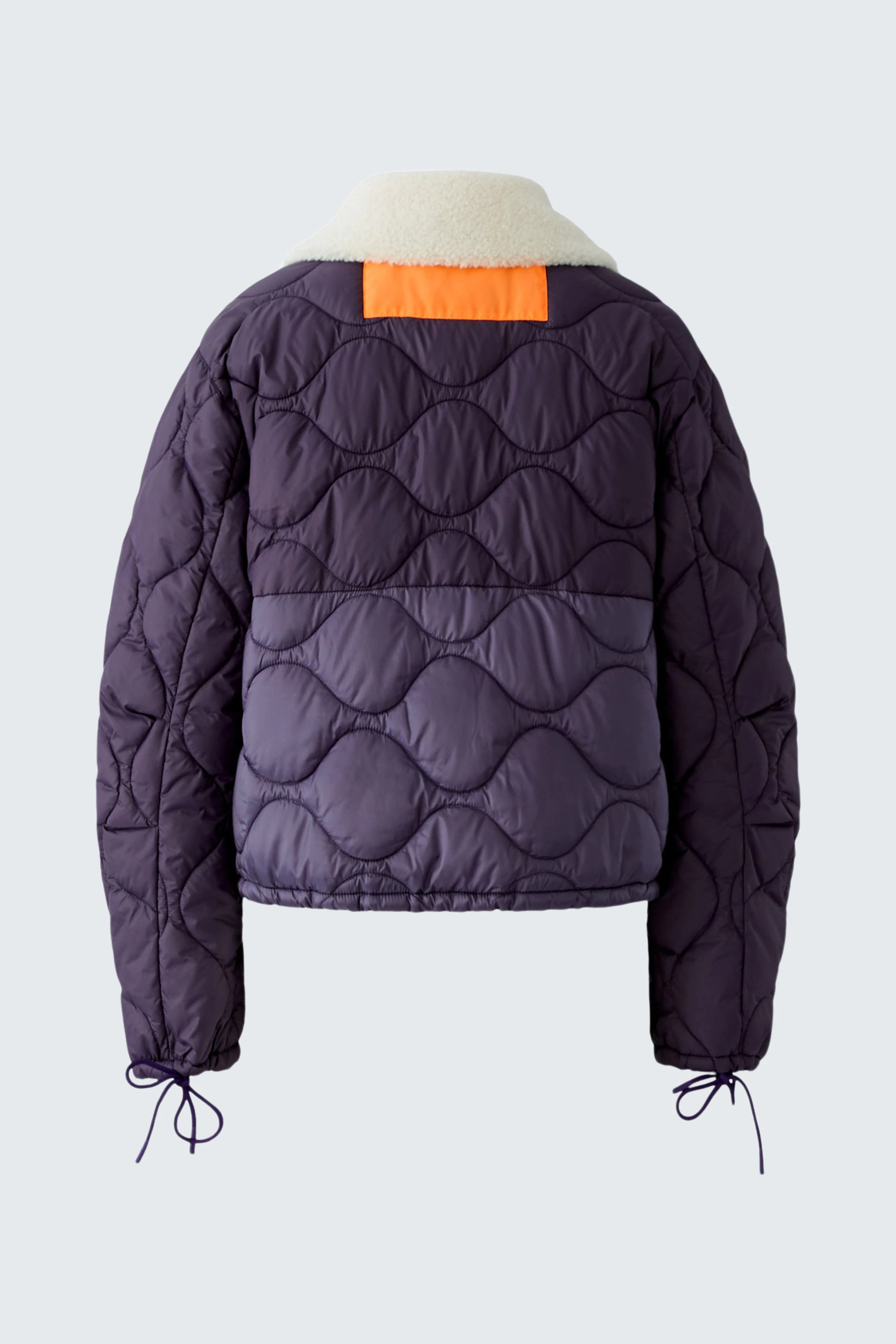 Reversible jacket: Quilted purple design with orange accent and cozy collar, perfect for versatile styling.