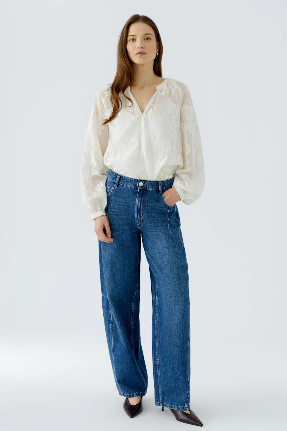 White tunic with floral texture, long sleeves, and relaxed fit. No model, just the garment.