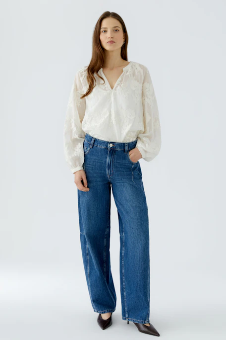 White tunic with floral texture, long sleeves, and relaxed fit. No model, just the garment.