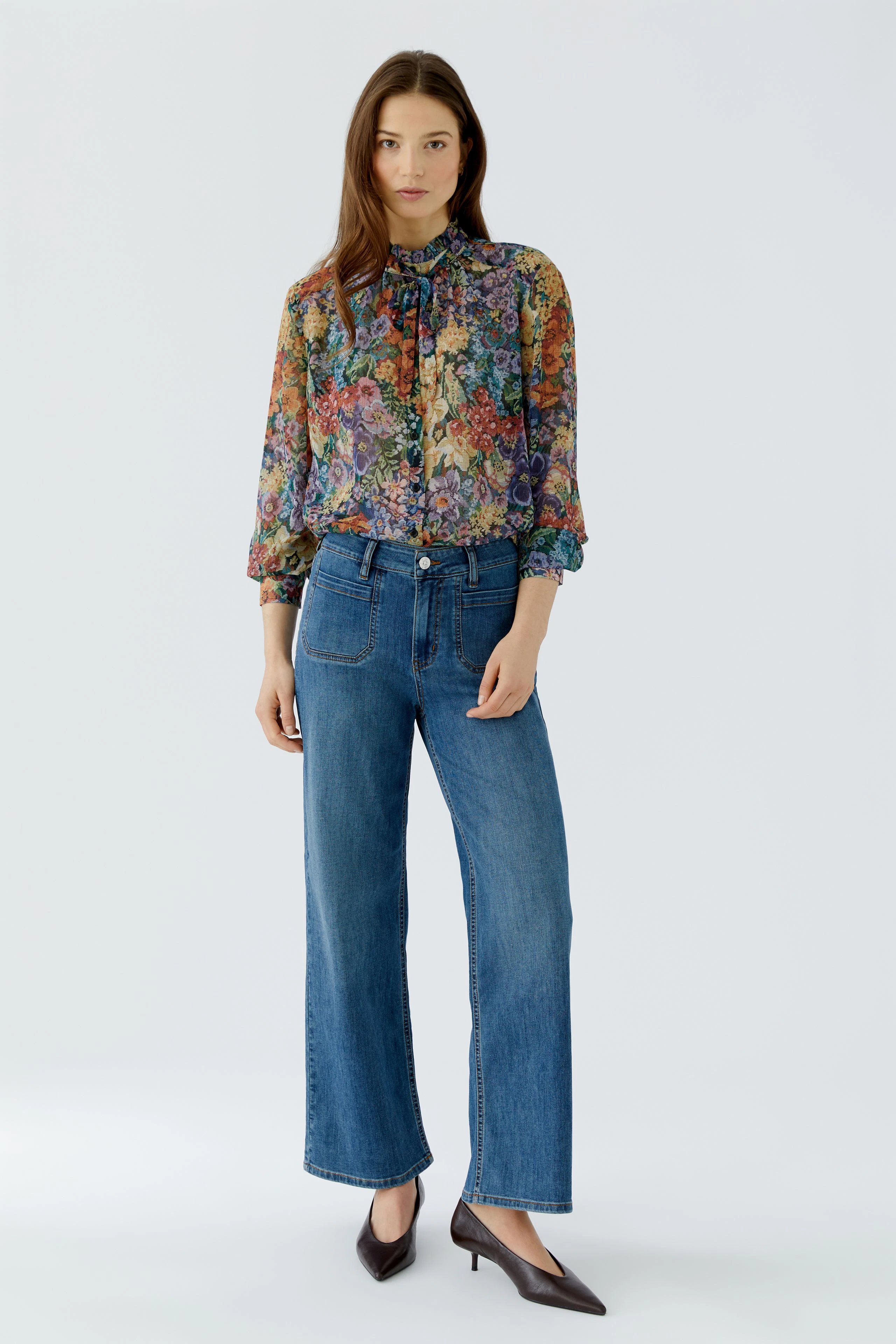 Bunte Damen-Bluse: Florales Muster, transparentes Design, ideal für einen frischen, modischen Look.