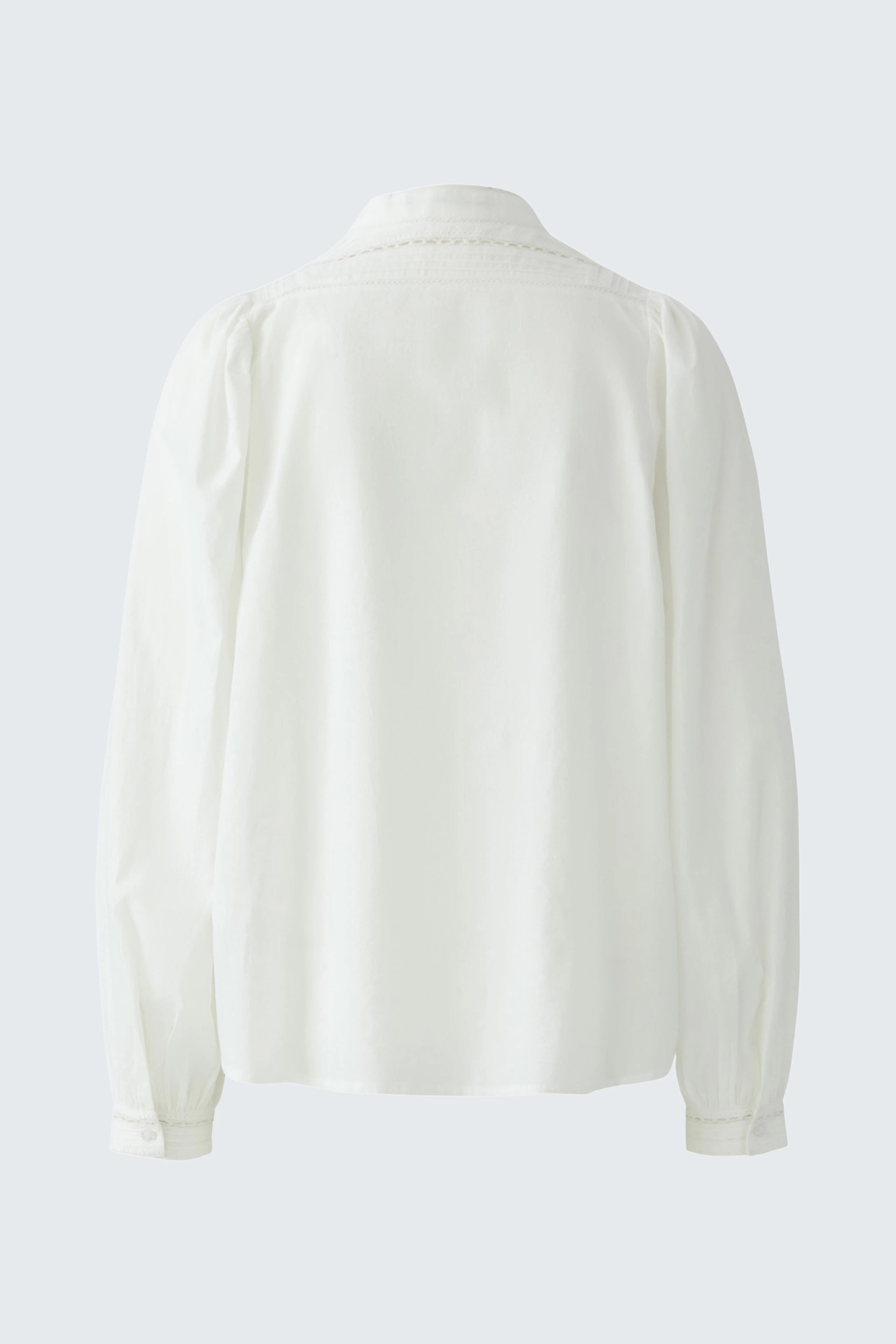 White blouse: Simple, classic design with long sleeves and a relaxed fit, perfect for everyday wear.