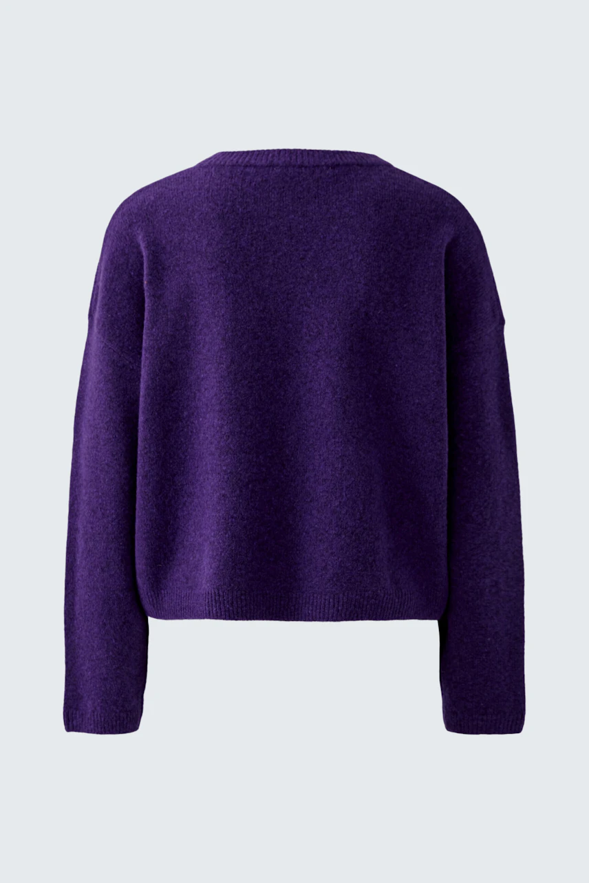 Casual women's pullover in deep purple, shown from the back, highlighting its relaxed fit and soft texture.