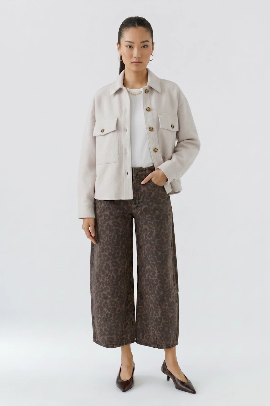 Casual women's overshirt in light beige with button-up front and chest pockets.