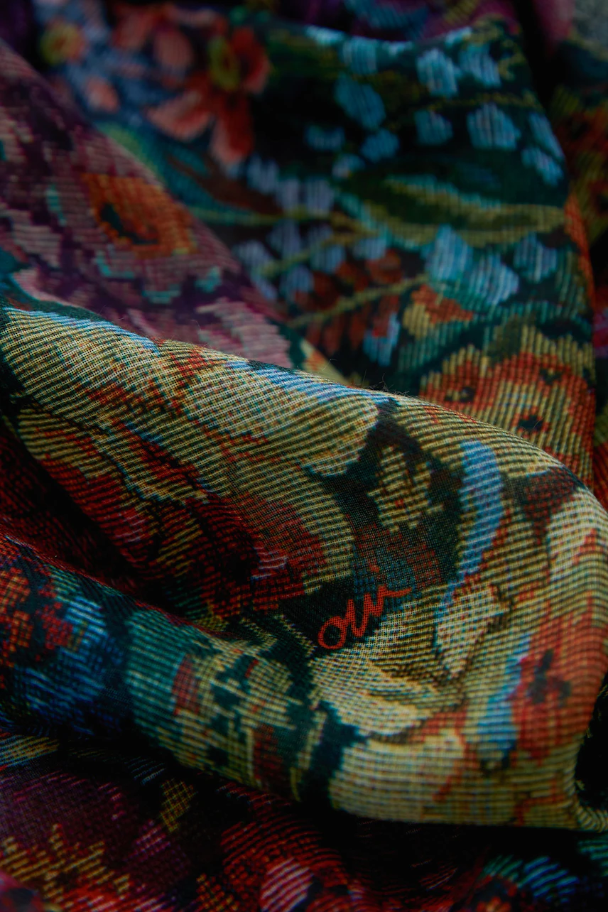 Colorful floral scarf with intricate patterns, perfect for adding a vibrant touch to any outfit.