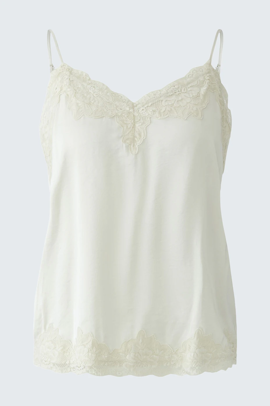White lace-trimmed top: Simple and stylish, perfect for layering or wearing alone.