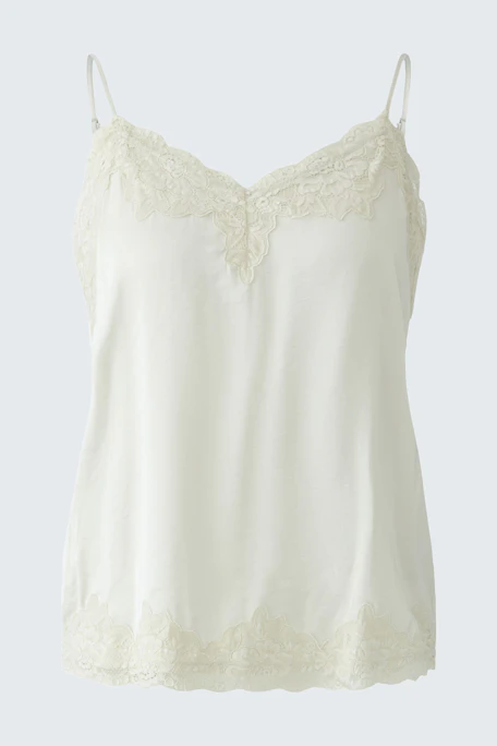 White lace-trimmed top: Simple and stylish, perfect for layering or wearing alone.