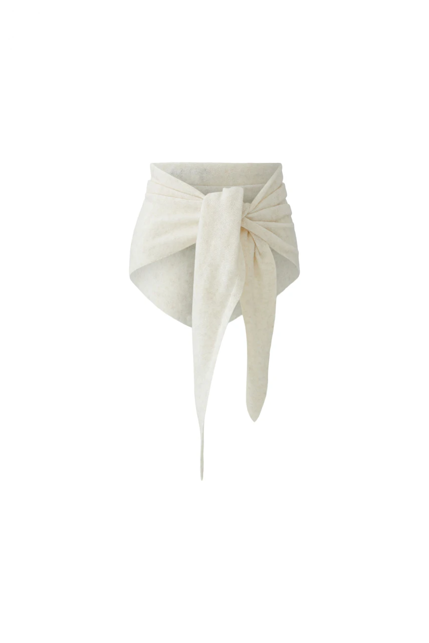 Soft beige scarf with a stylish knot design, perfect for adding a cozy touch to any outfit.