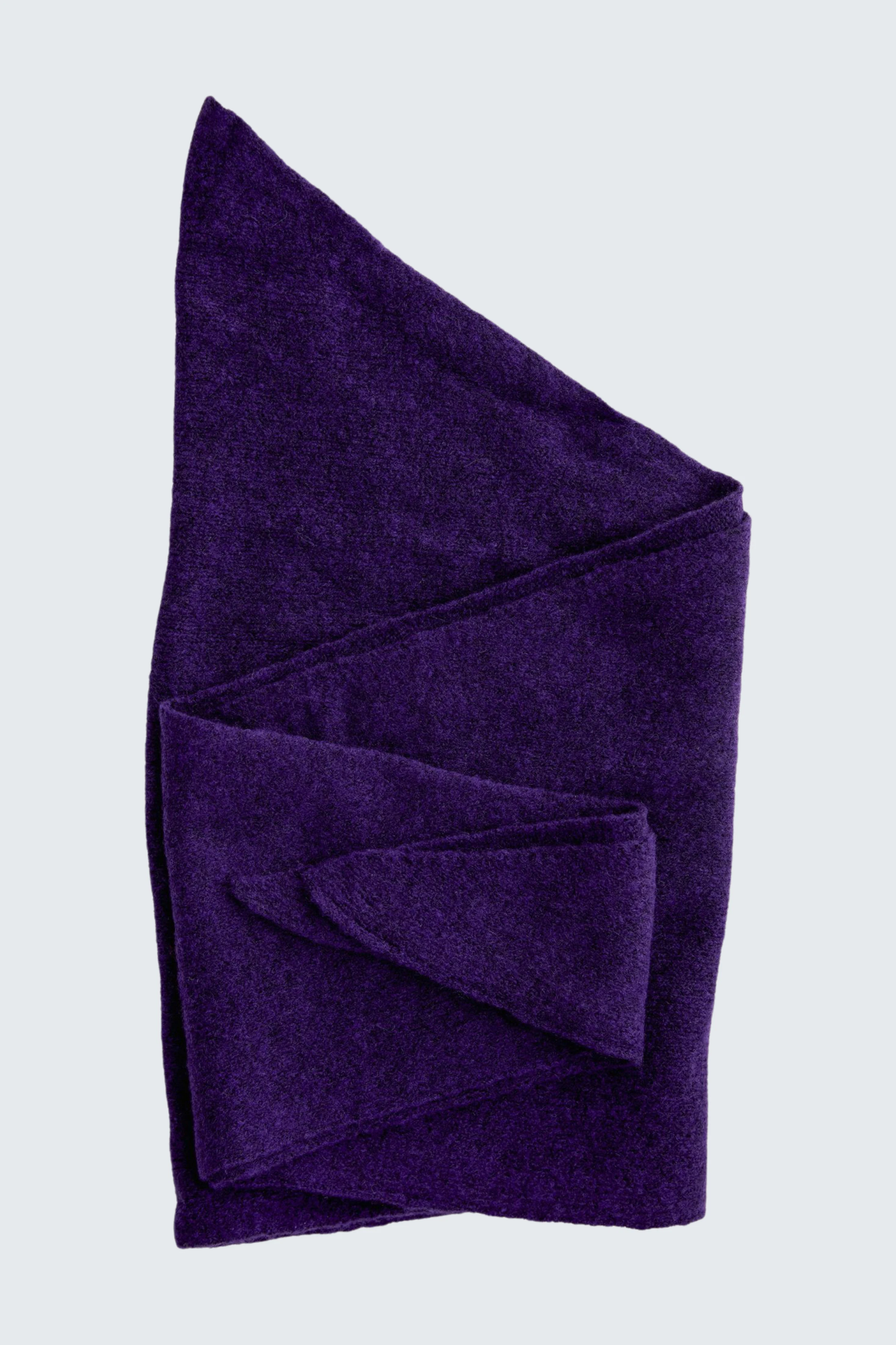 Purple scarf folded neatly, showcasing soft texture. Ideal for adding a pop of color to any outfit.
