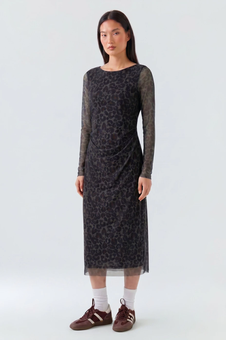 Leopard print midi dress with sheer sleeves, perfect for a bold and stylish look.