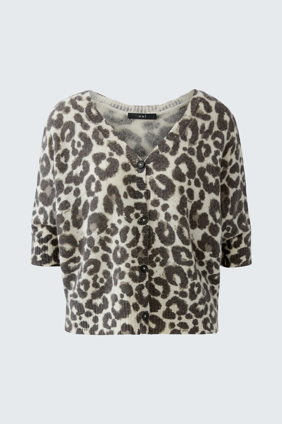 Leopard print cardigan: Soft knit with button closure, perfect for layering. No model, just the garment.