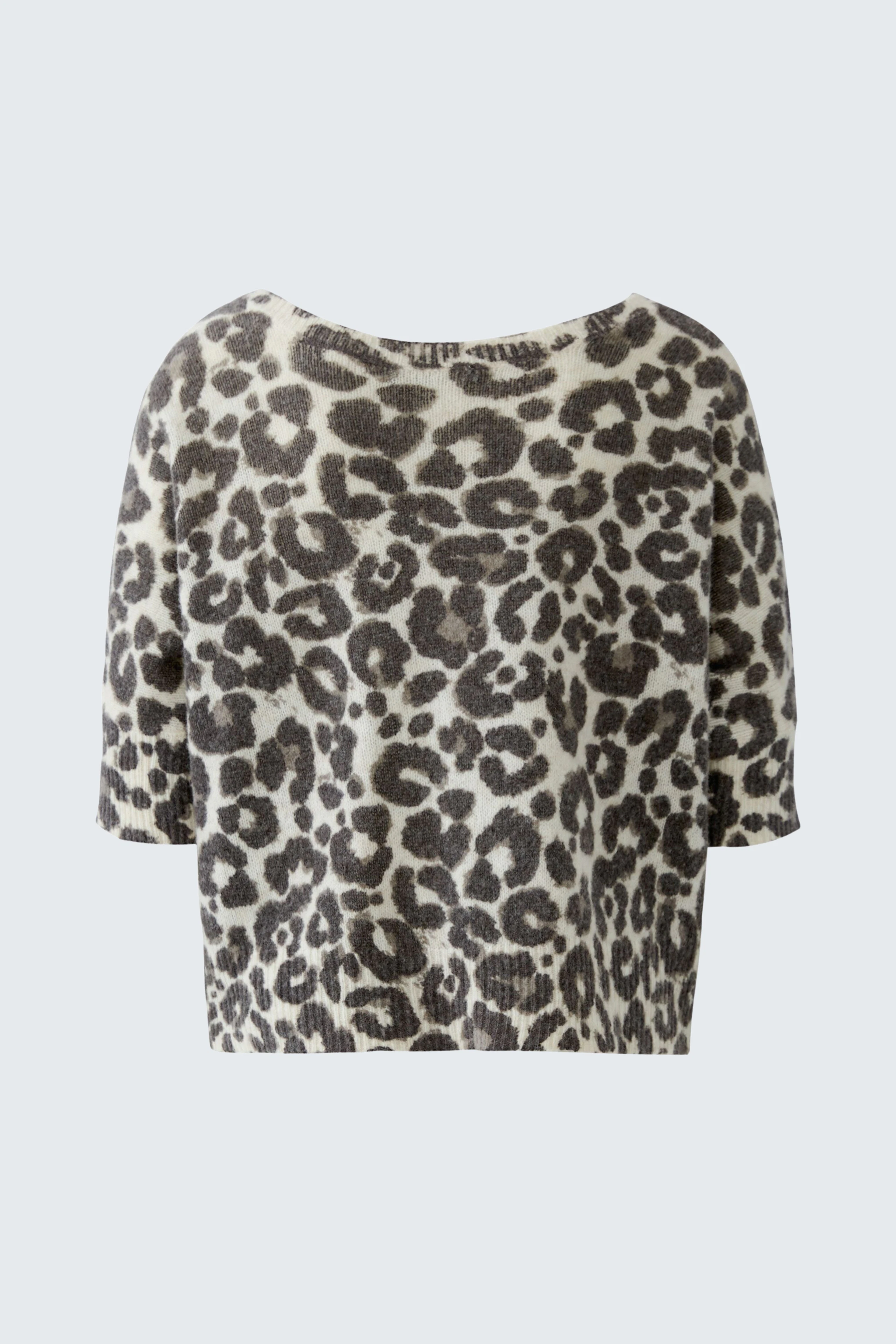 Leopard print cardigan: Cozy knit with short sleeves, perfect for layering. No model, just the garment shown.