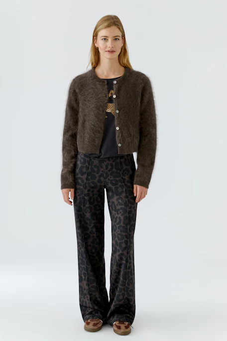 Cozy knit cardigan: Soft brown cardigan with button-up front, perfect for layering in cooler weather.