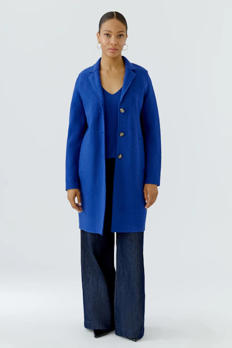 Blue wool coat: Simple, buttoned design with pockets, perfect for a stylish, warm look.