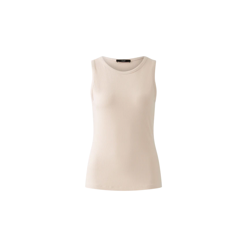 Elegant women's top: A woman in a light beige sleeveless top, showcasing a sleek and modern design.