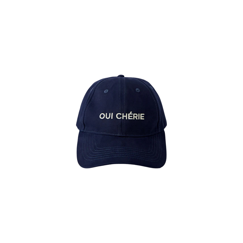 Casual navy cap with 'OUI CHÉRIE' lettering, perfect for everyday wear.
