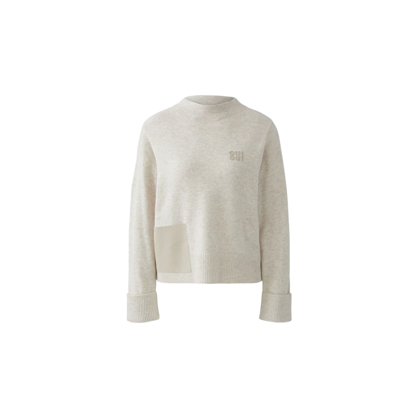 Casual women's pullover in light beige with a unique patch detail and a relaxed fit.