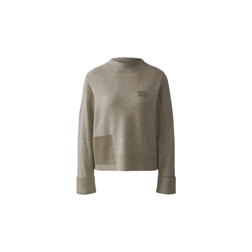 Casual women's pullover in light beige with a unique patch detail and relaxed fit.