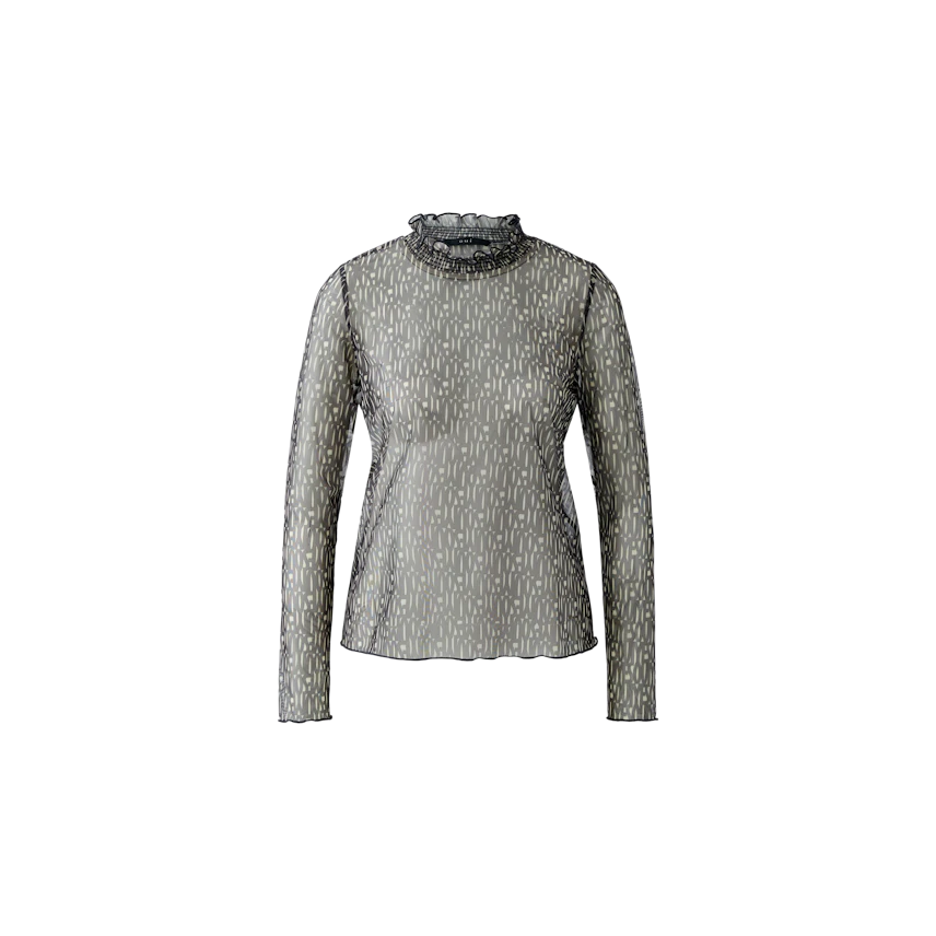 Stylish long-sleeve shirt: A woman in a patterned top with a high neckline, perfect for casual wear.