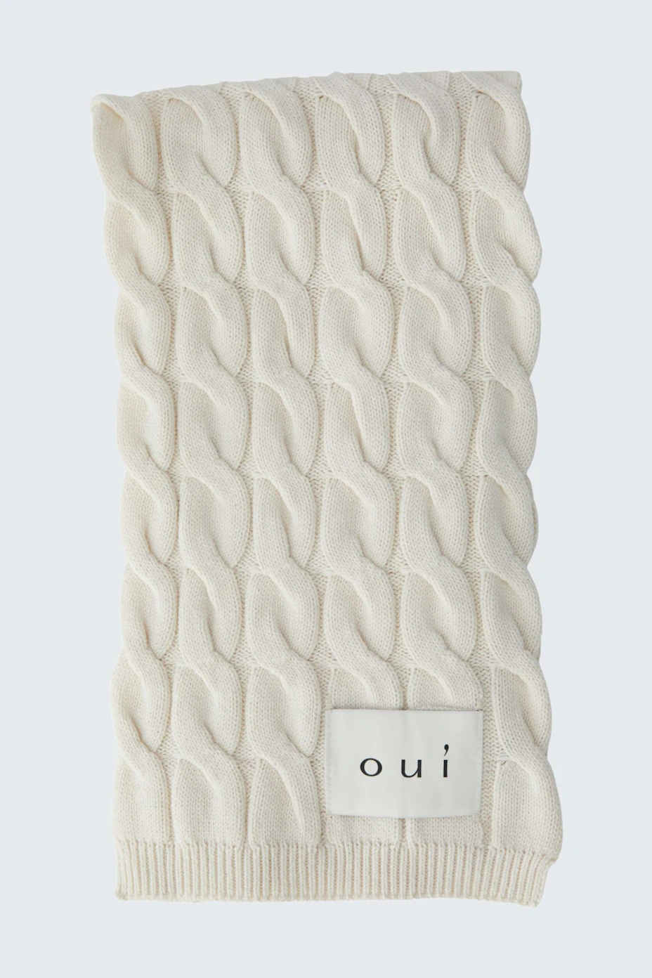 Cozy cream scarf with textured pattern, perfect for layering in cooler weather. Soft and stylish accessory.