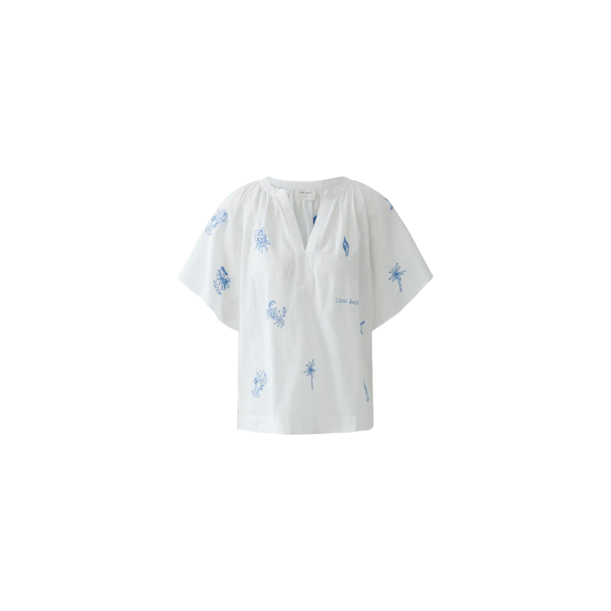 White blouse with blue prints: Casual and loose-fitting, perfect for a relaxed summer look.