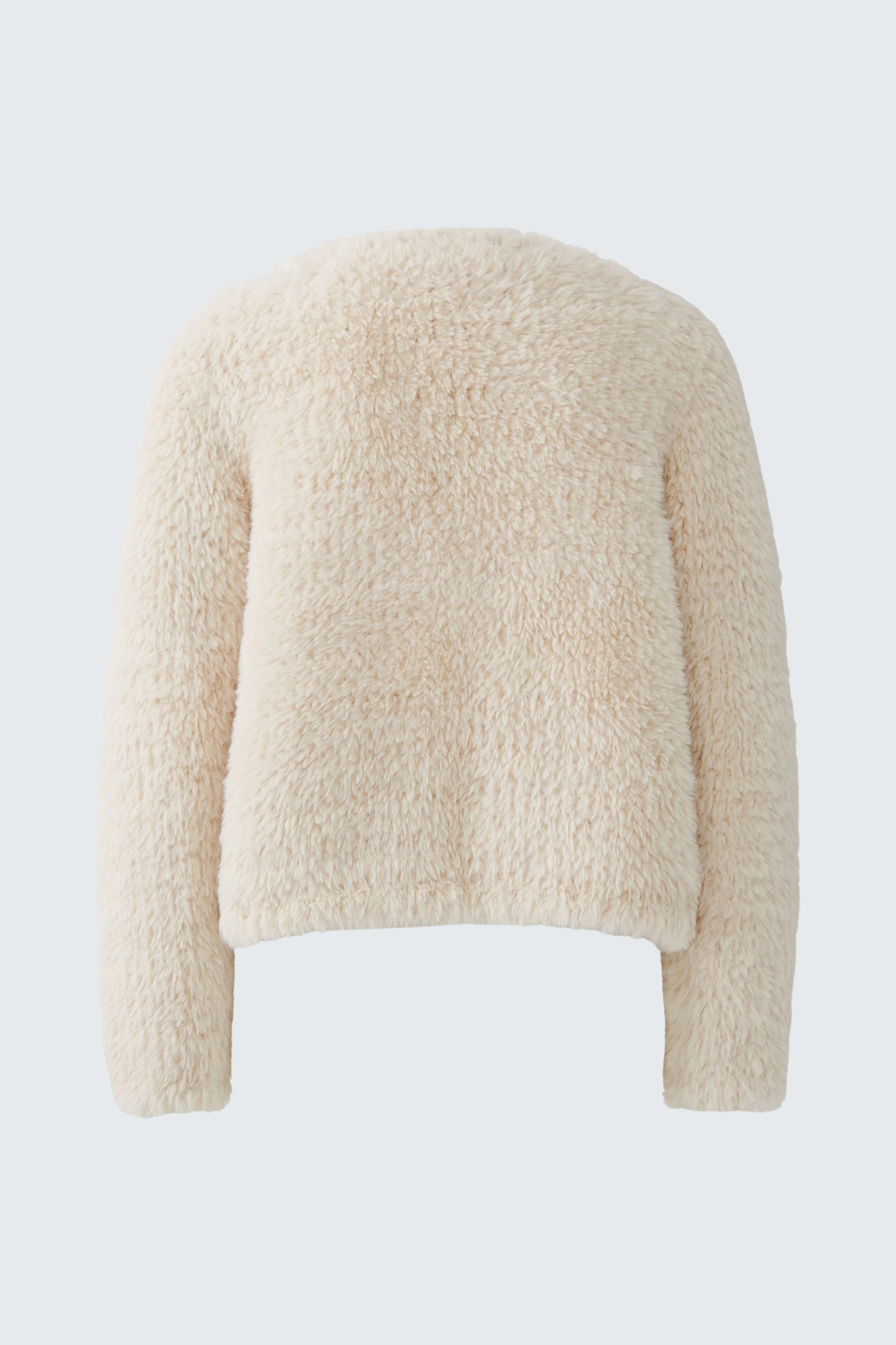 Kuschelige Strickjacke in Creme: Weiches Material, ideal für gemütliche Tage. Ohne Model abgebildet.