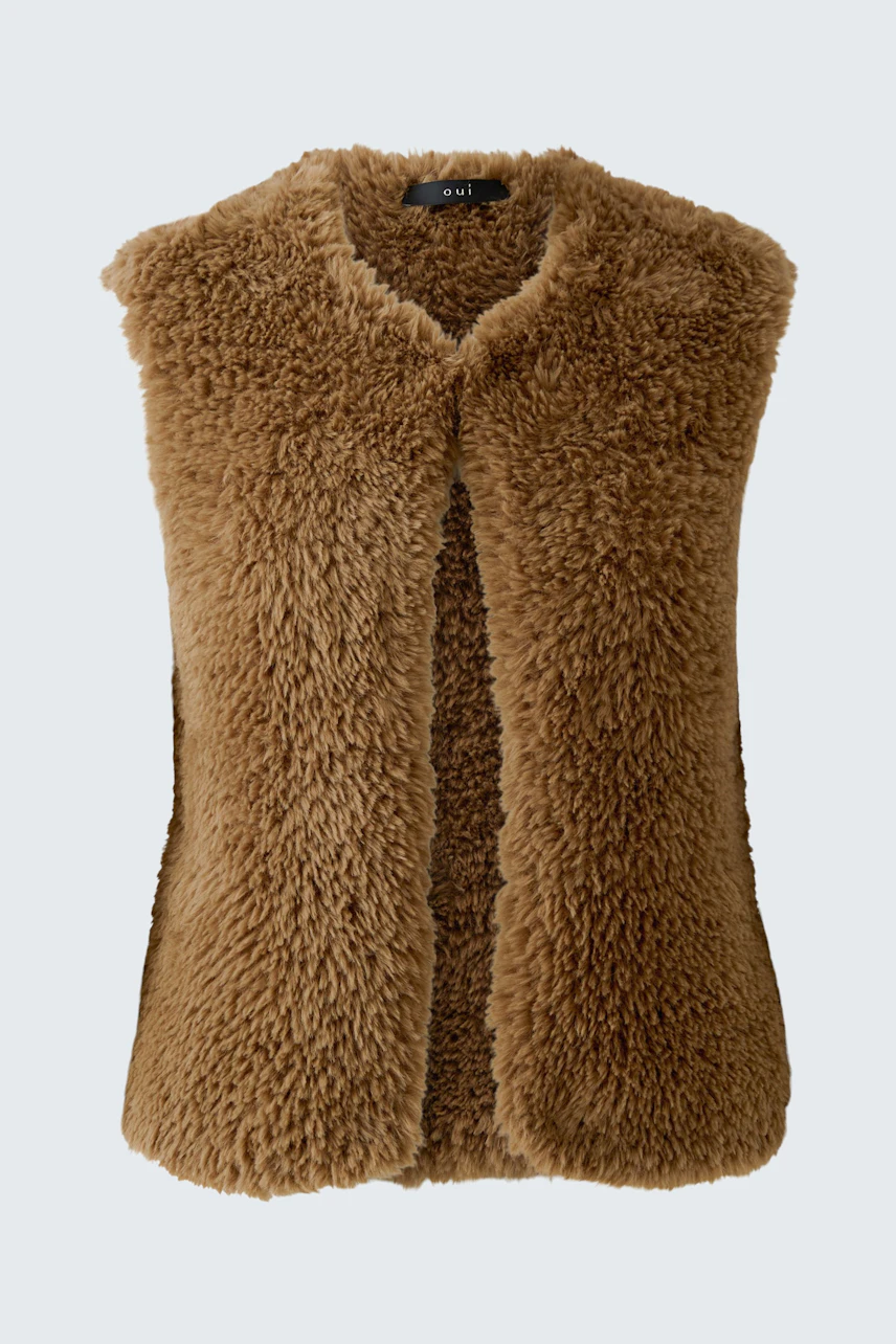 Cozy women's knit vest in brown faux fur, perfect for layering and adding texture to any outfit.