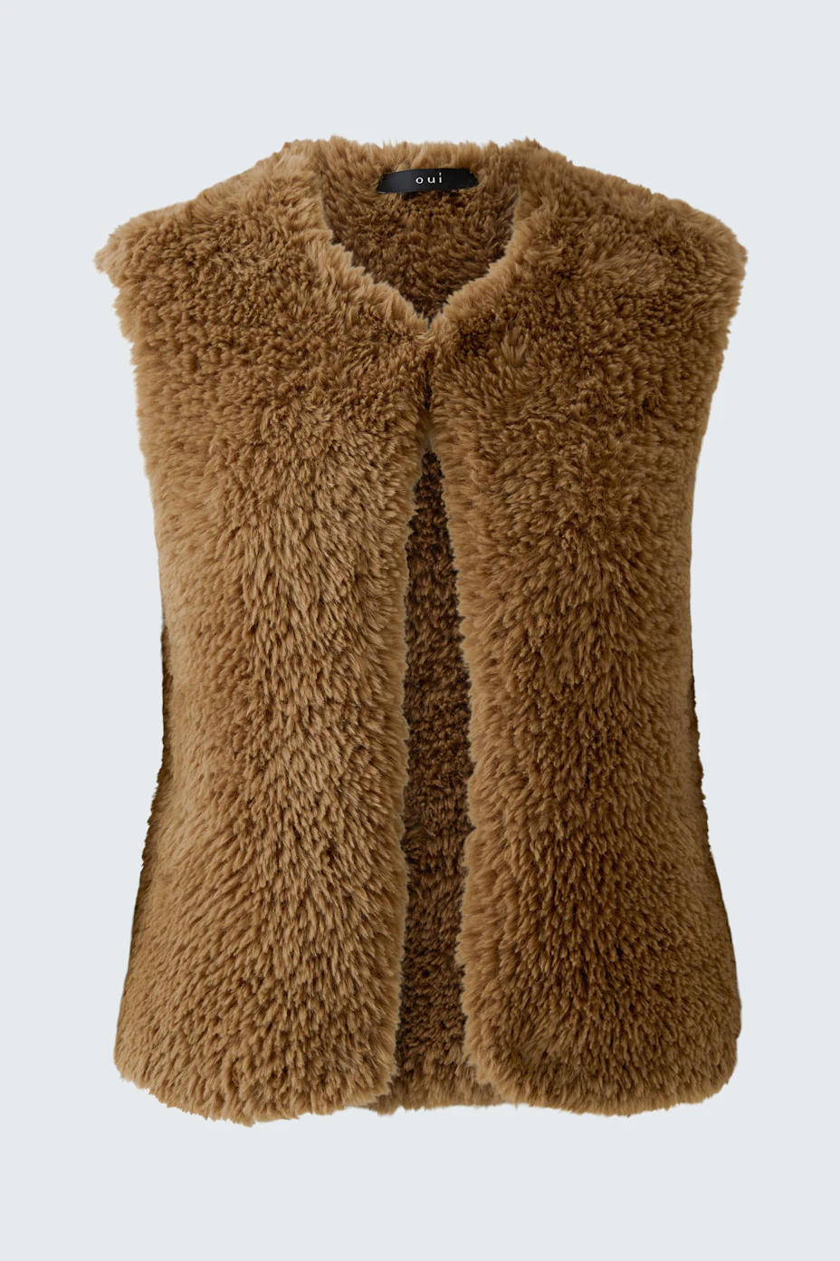 Cozy women's knit vest in brown faux fur, perfect for layering and adding texture to any outfit.