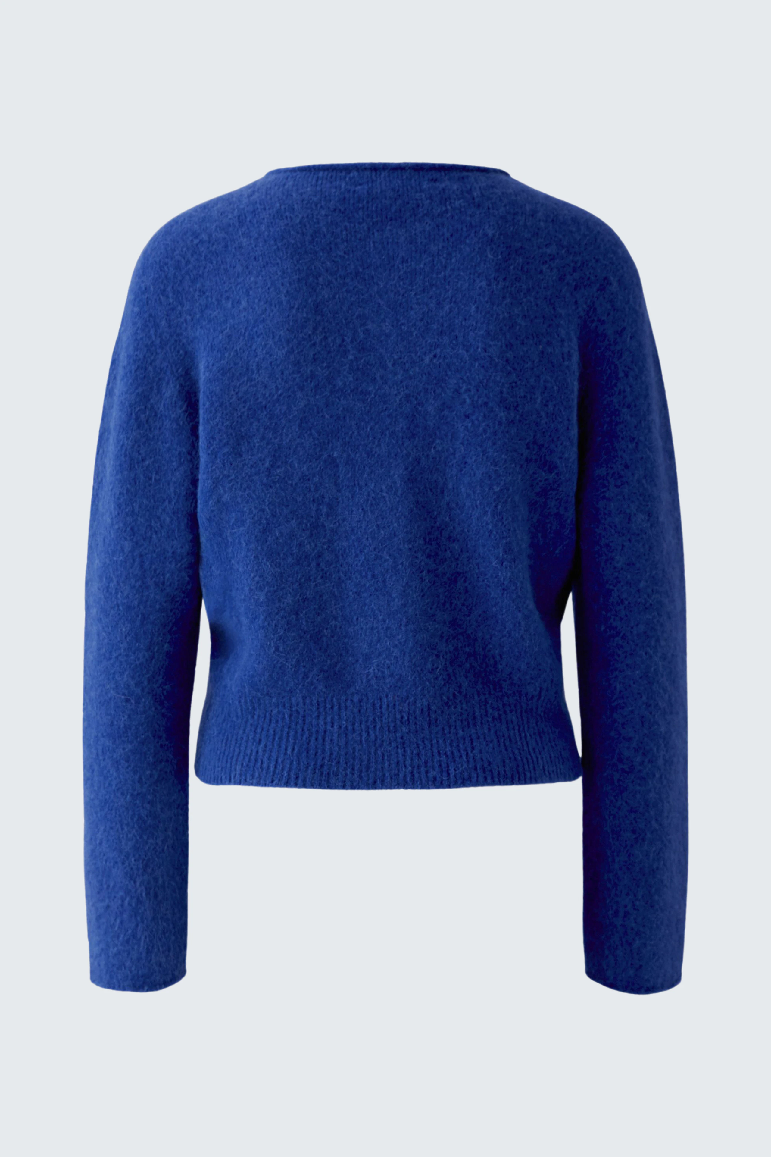 Blue knit cardigan: Simple and cozy design, perfect for layering in cooler weather.