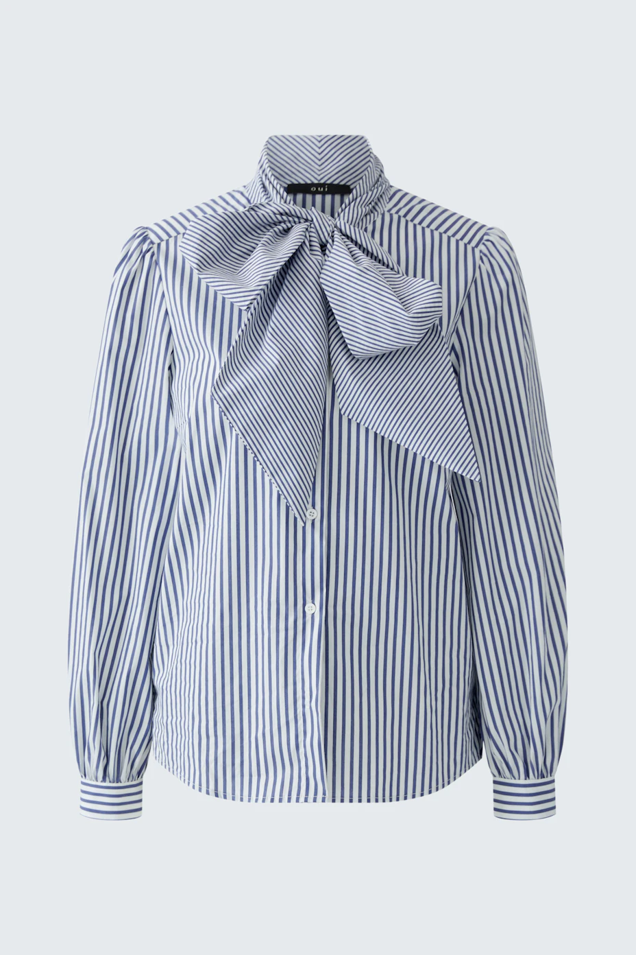 Striped pussy-bow blouse: Blue and white stripes with a large bow, perfect for a chic, casual look.