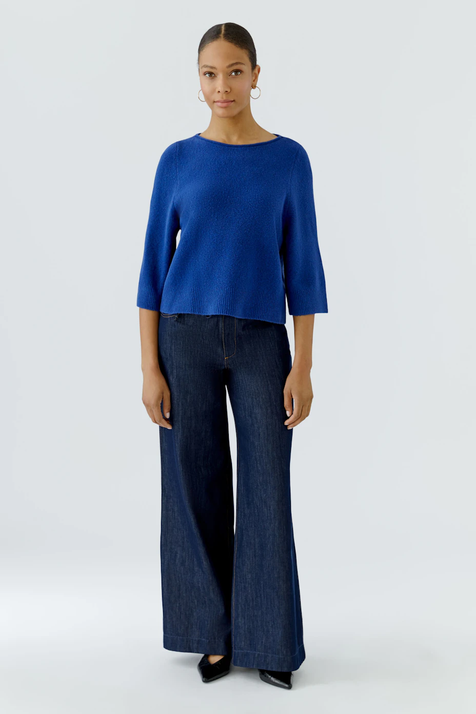 Blue pullover: Simple, loose-fit design with wide sleeves, perfect for casual wear.